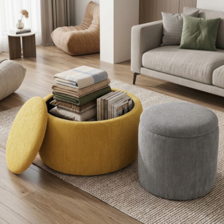Round white-and-black Wrought Studio lift-top coffee table with concealed storage and three matching ottomans for a compact living room.