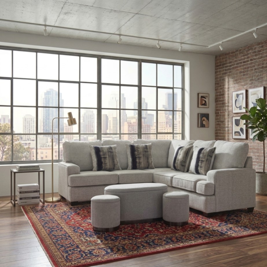 Homebox Evelyn 3-piece grey fabric ottoman set with storage, featuring one large ottoman and two smaller stools for flexible seating in a studio apartment living room.